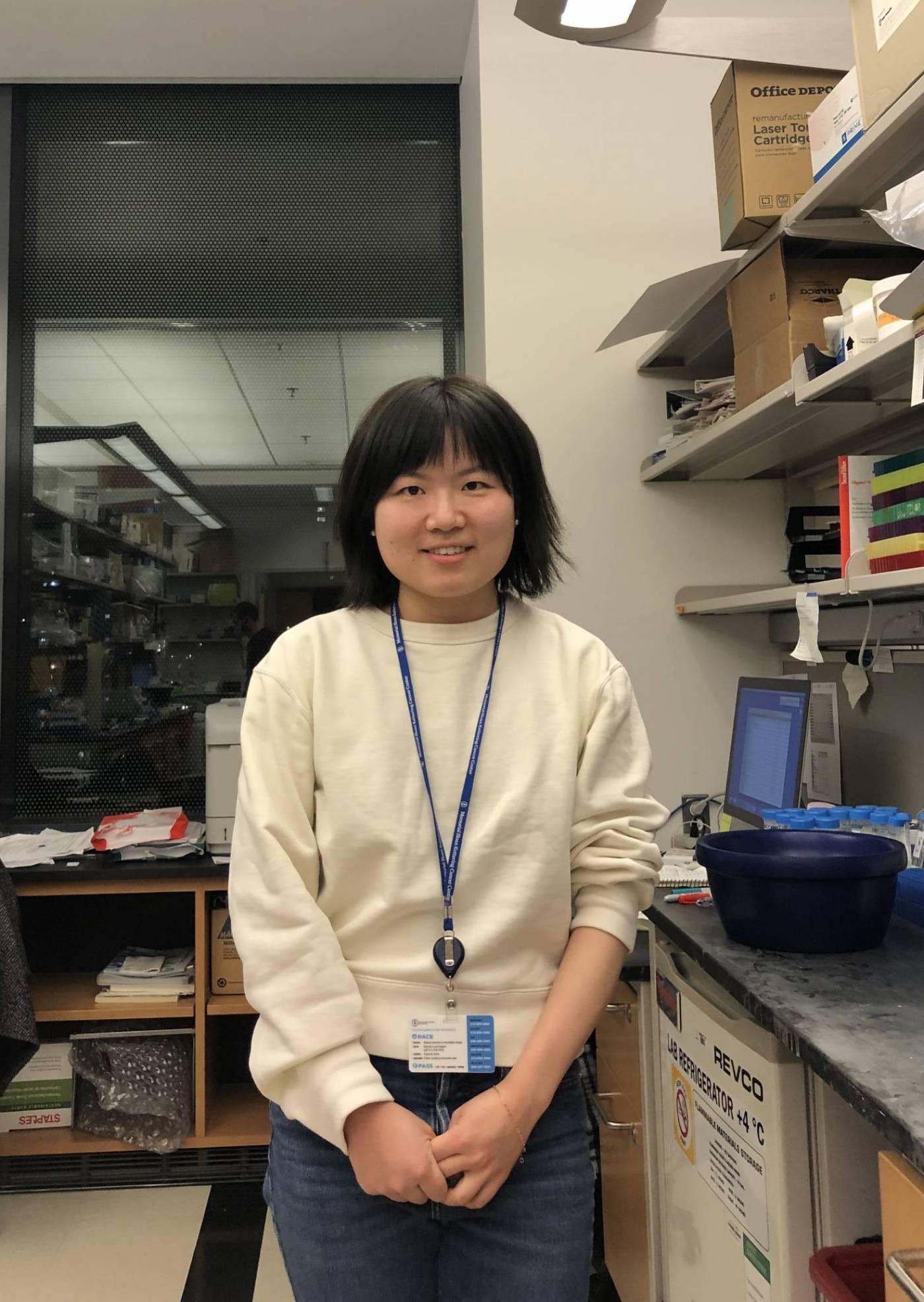 Picture of Vicky standing beside her lab bench.